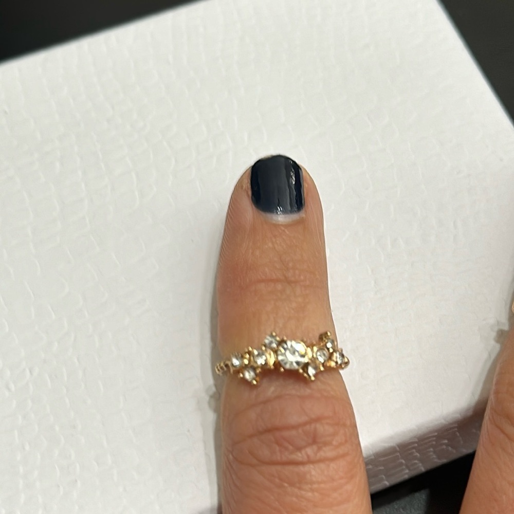 Brand new Costume Jewelry. Rose gold ring. Sparkle. Approx size 6.